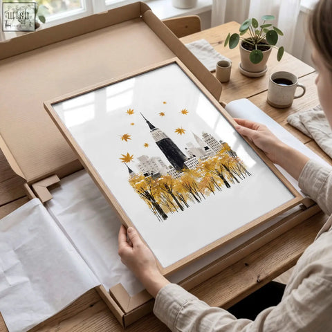 Minimalist wooden framed travel wall art with stylized New York cityscape and golden autumn leaves in ochre tones