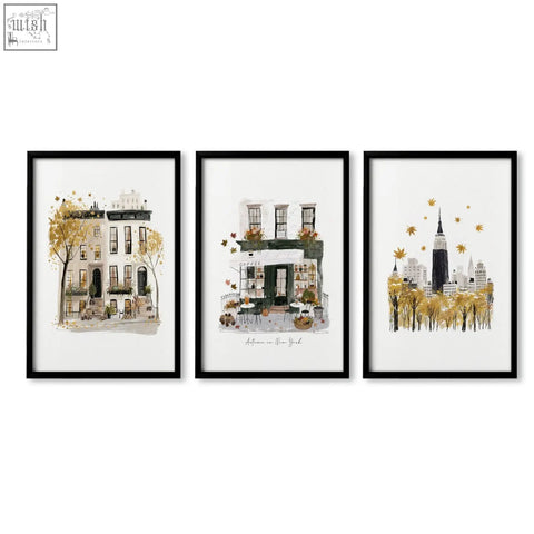Set of three framed black travel wall art prints featuring new york autumn cityscapes with golden leaves