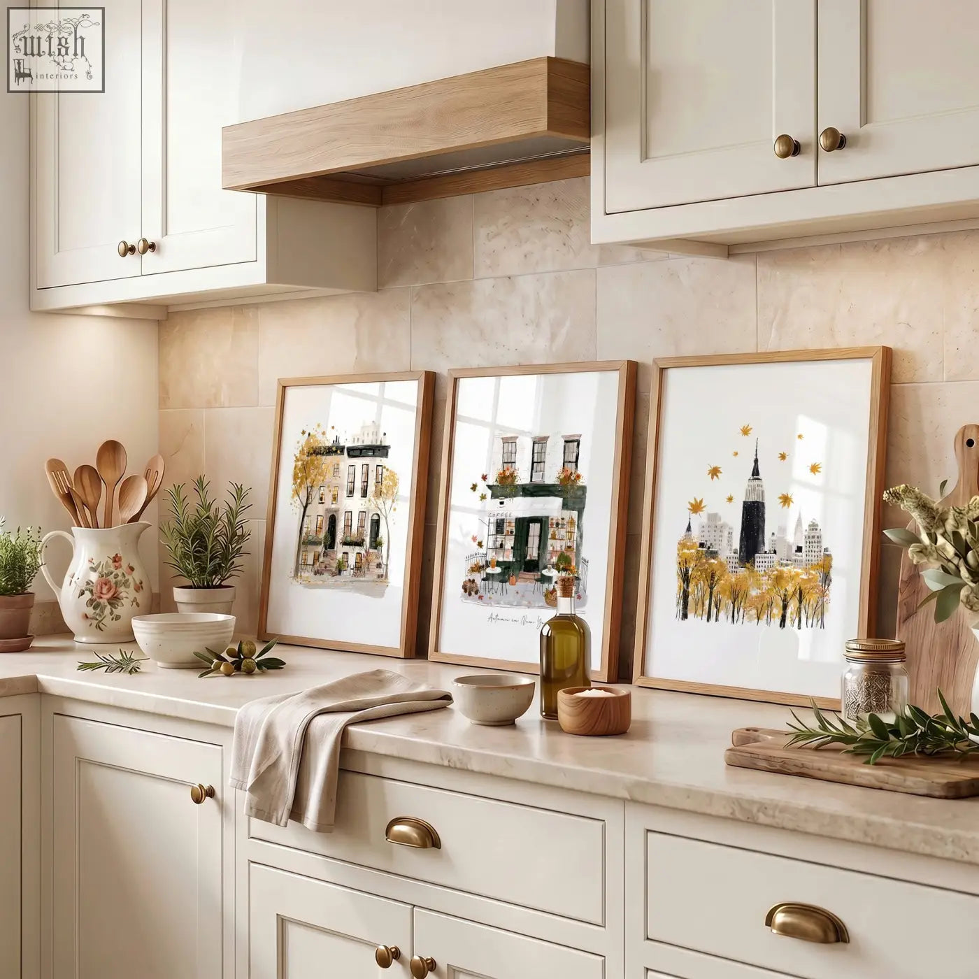 Three framed travel wall art prints with autumnal gold and green watercolor cityscapes in light wood frames