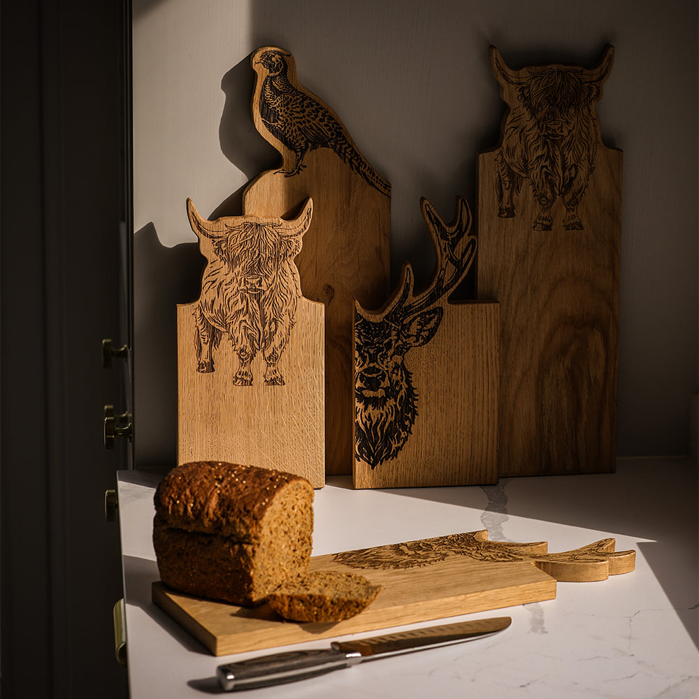 Rustic small framed oak serving board with laser engraved stag design and natural wood grain details