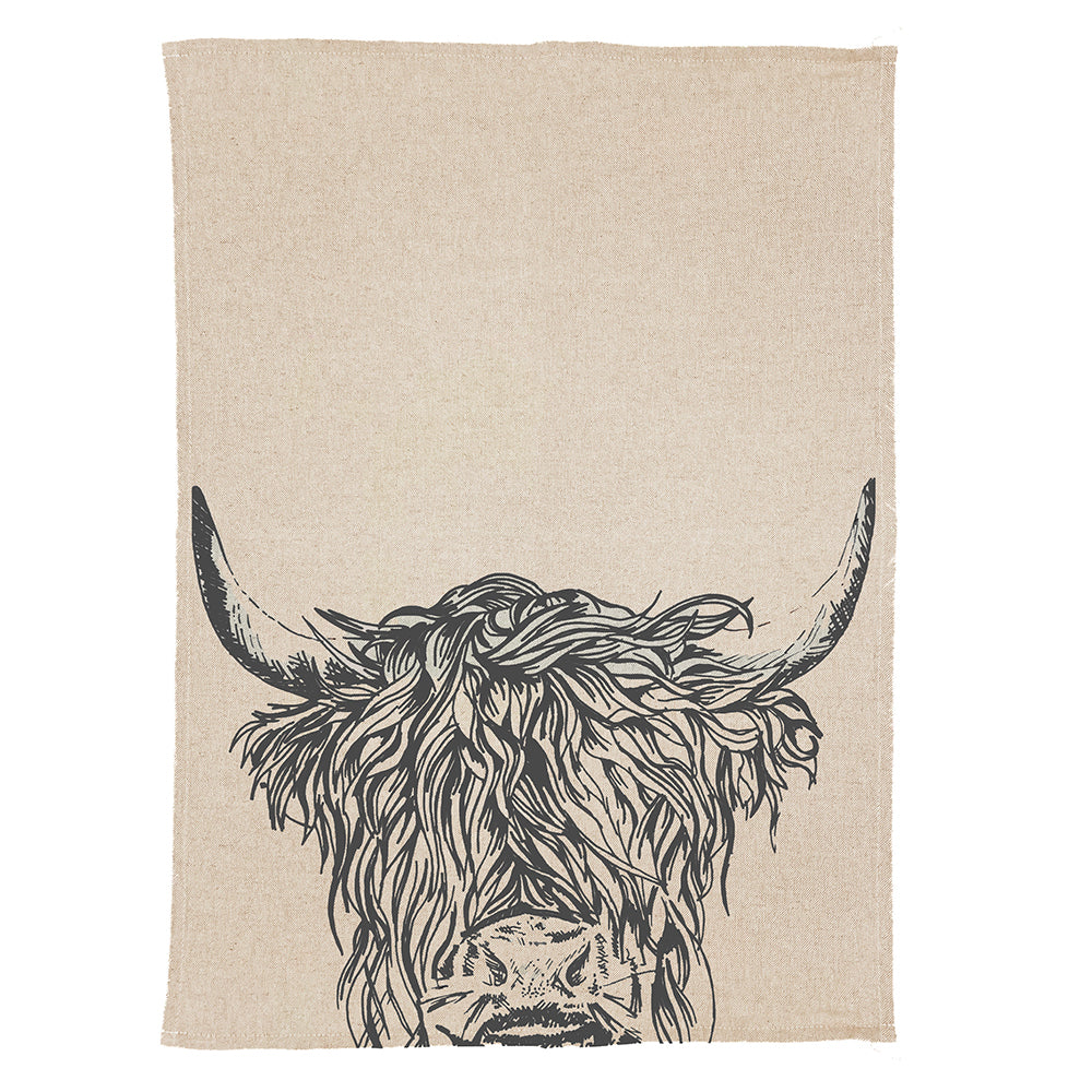 Beige linen tea towel with bold black ink illustration of highland cow head with flowing hair and curved horns
