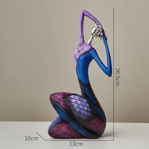 Vibrant abstract figurine of a seated woman in blue purple and black with textured patterns hikai ornament