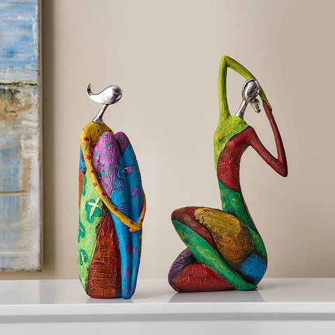 Vibrant hikari ornament resin figurines with metallic silver heads and colorful patterned bodies for decoration