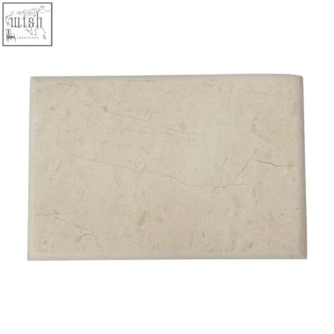 Cream-colored himaya champagne marble rectangular chopping and serving board with subtle natural veining