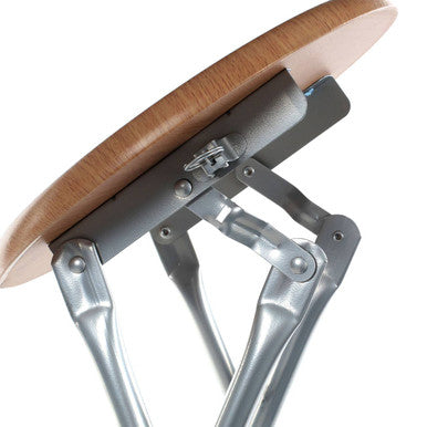 A sleek silver folding stool with a round wood veneer seat perfect for compact seating and easy storage