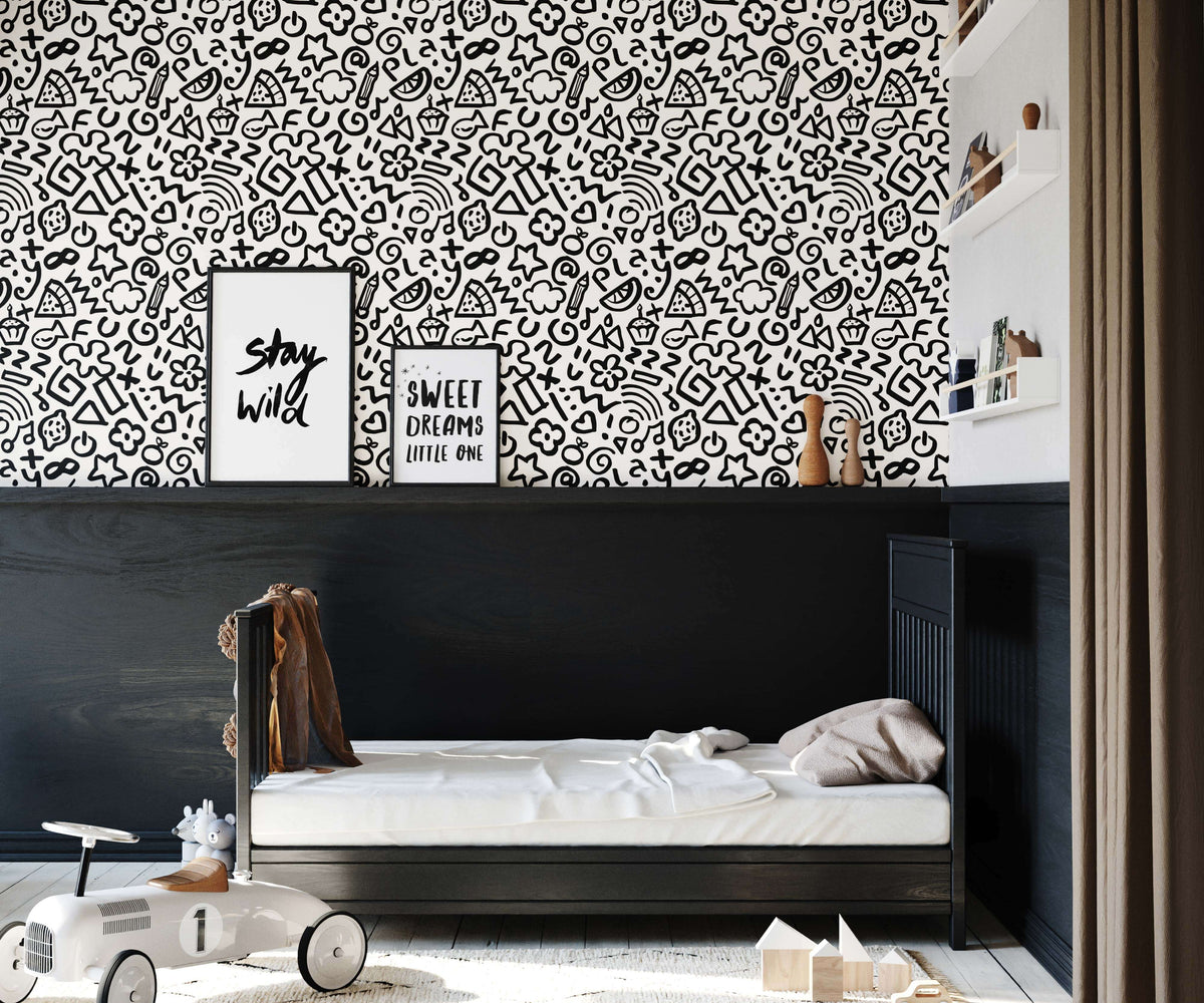Black and white doodle patterned wallpaper hip with whimsical fruits stars hearts and abstract shapes design