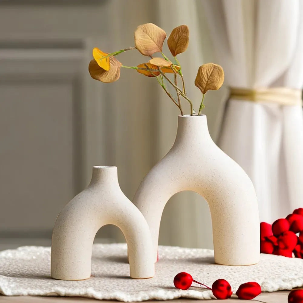 Cream-colored ceramic hiroki vases with modern arched design perfect for stylish home decor