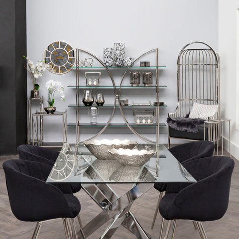Shiny silver mirrored glass plant stand with geometric chrome base perfect as a black mirrored glass accent piece