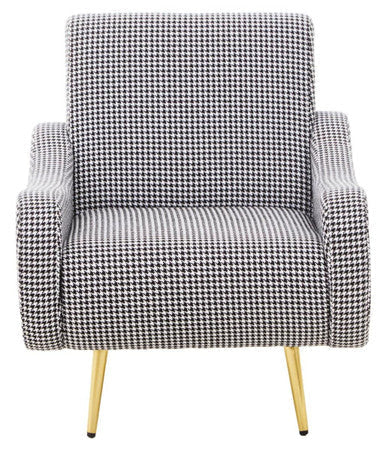 A sleek holli black and white checked armchair with houndstooth pattern and slender gold finish legs