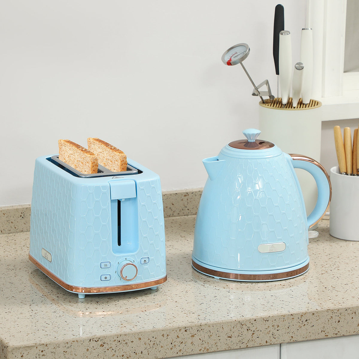 Light blue two-slice toaster with textured honeycomb pattern and rose gold trim in homcom fast boil kettle set