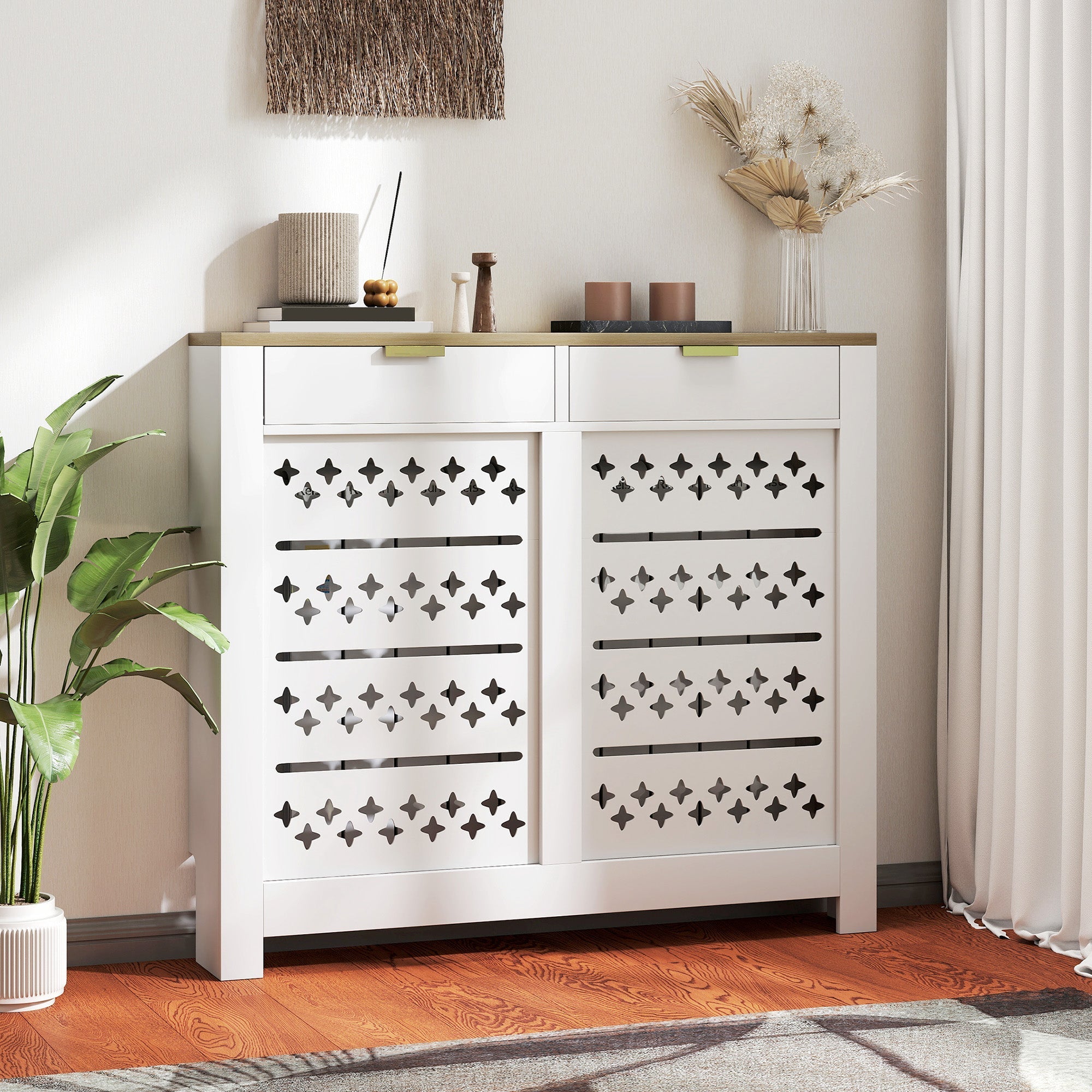 White particle board shoe cabinet with black cross cut-outs and horizontal slats featuring a light wood top