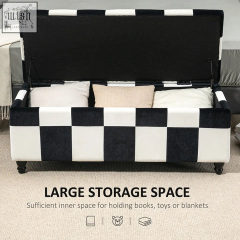 Black and white colour block storage ottoman with plush velvet finish and wooden legs for bedroom or living room storage