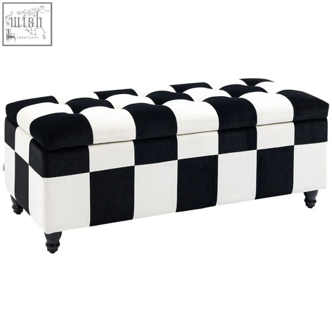 Black and white colour block velvet storage ottoman with button tufted top and turned wooden legs for living room