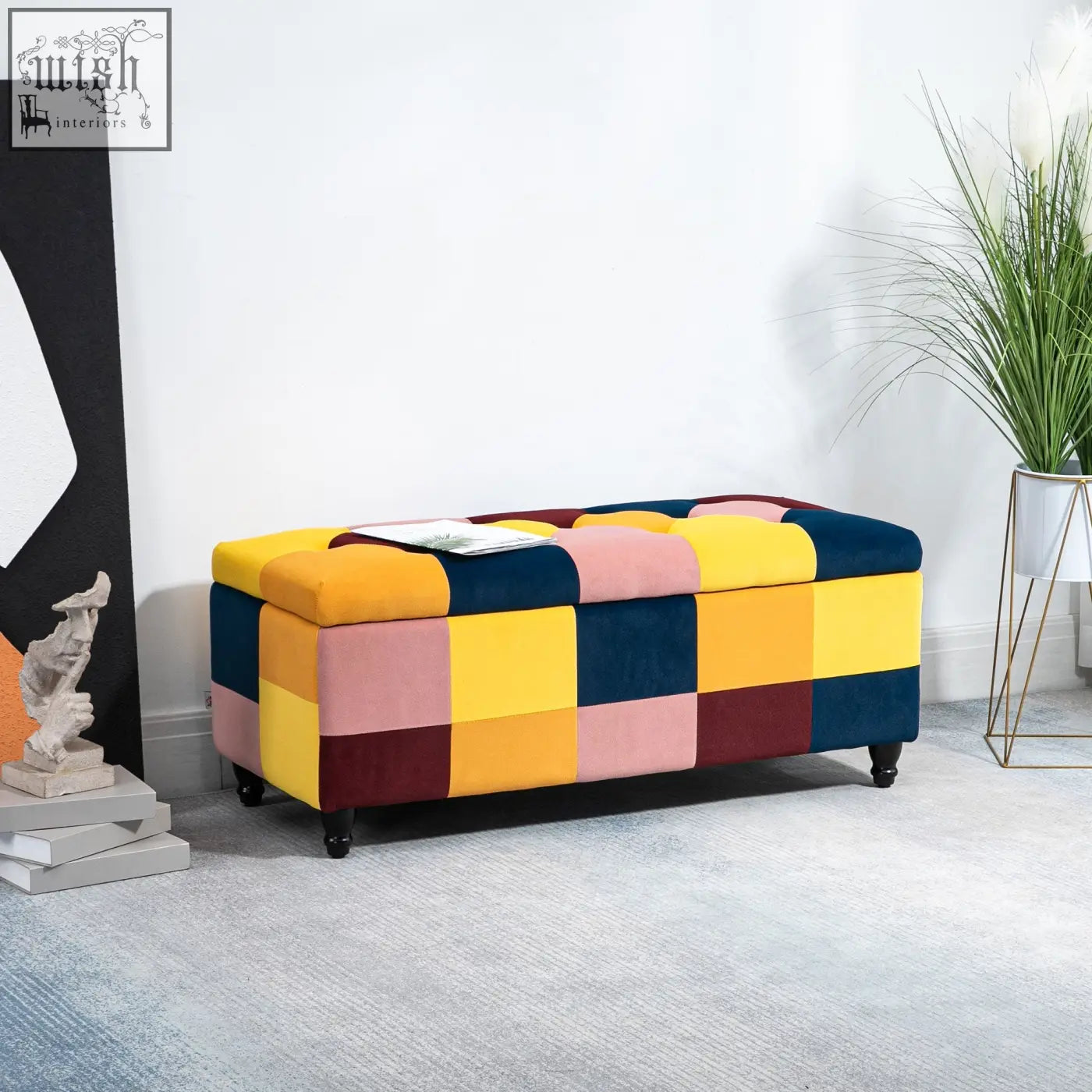 A vibrant multicoloured velvet storage ottoman with button tufted top and dark wooden legs perfect for living room storage