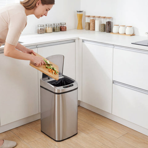 Stainless steel sensor bin with infrared sensing and manual touch button featuring a transparent lid for kitchen use