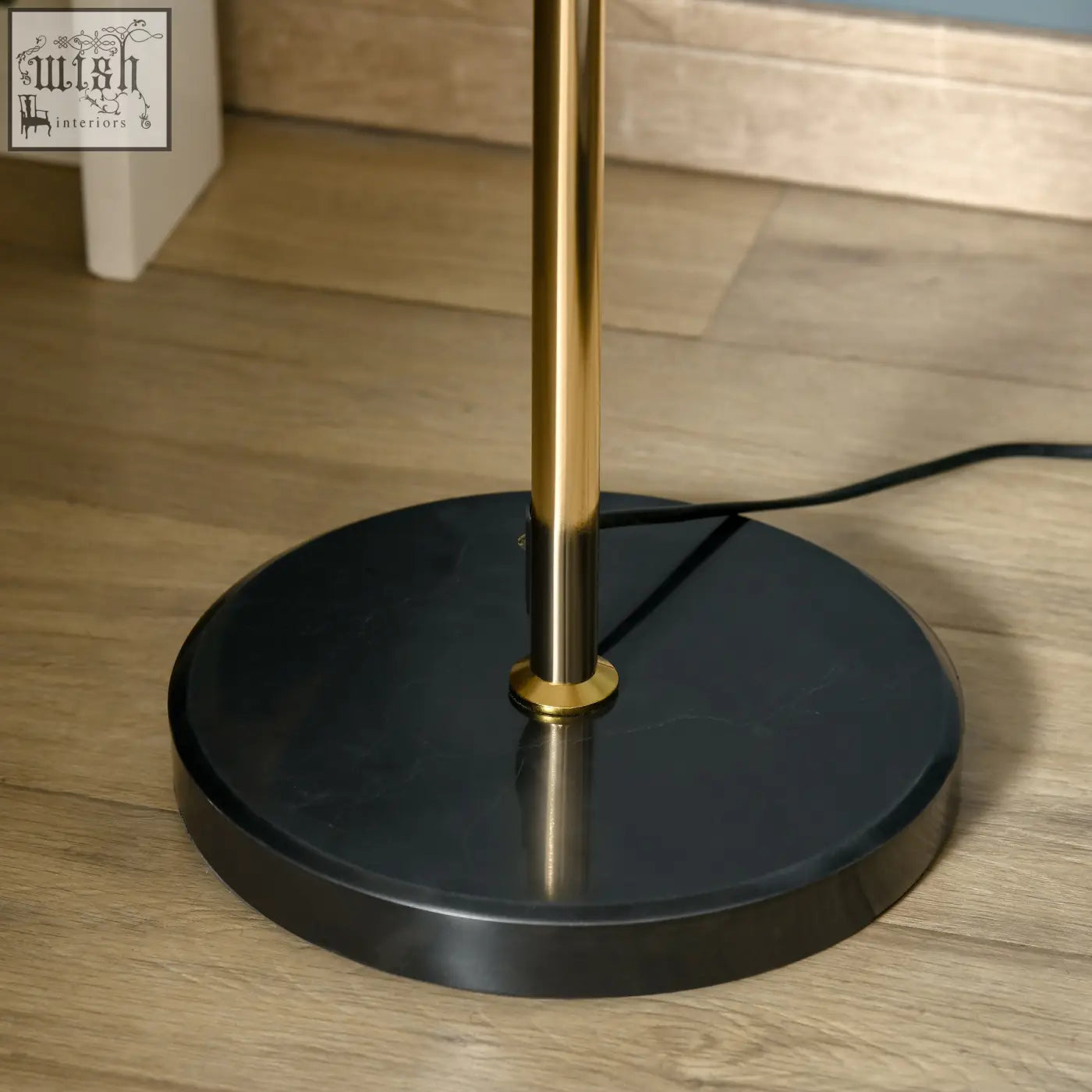 A sleek black marble base floor lamp with a polished gold-toned metal pole and convenient foot switch by homcom