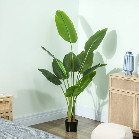 Tall artificial bird of paradise plant with vibrant green peva leaves and flocked soil in sleek black pot for decor