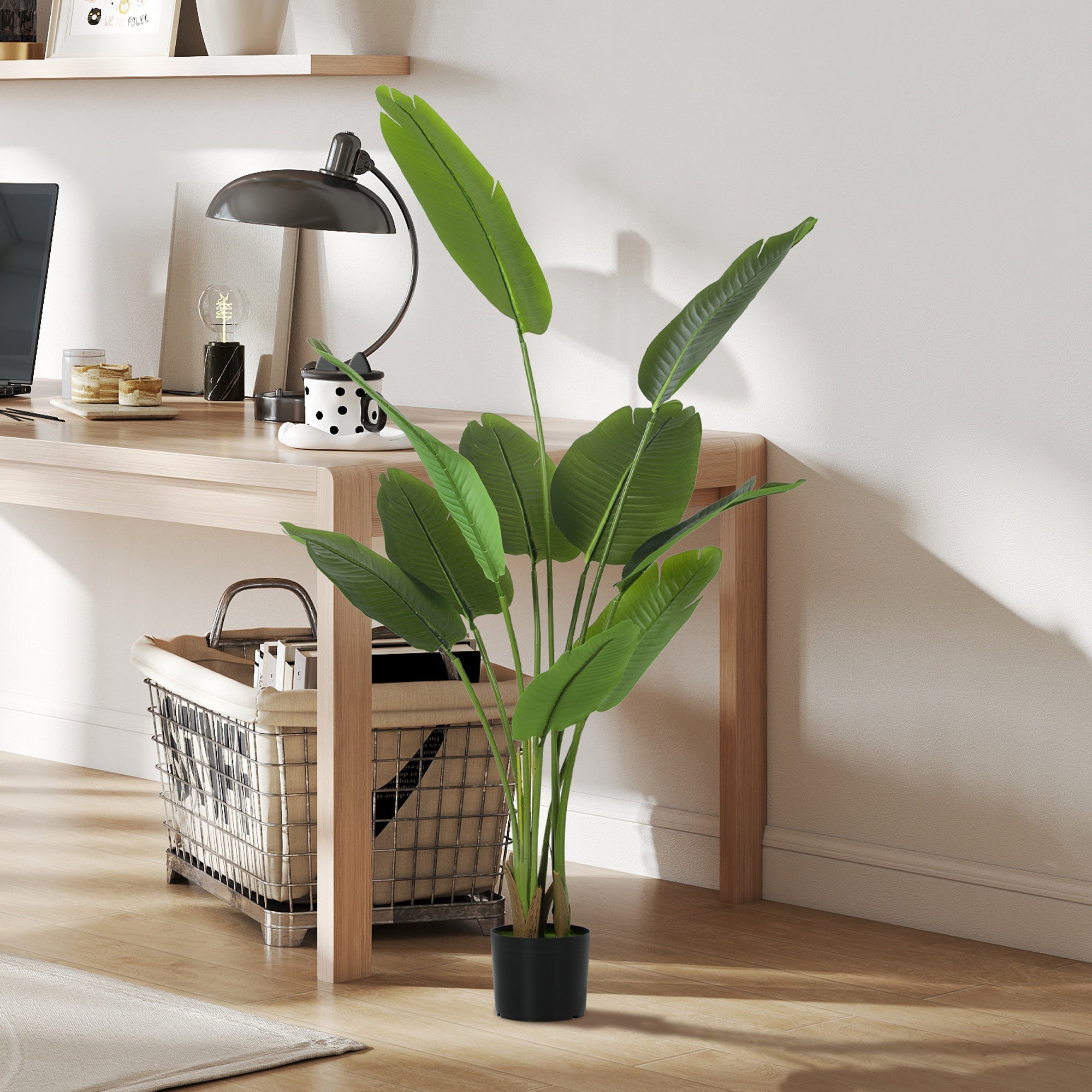 Tall green artificial bird of paradise plant with peva leaves and flocked soil in black pot for home decor