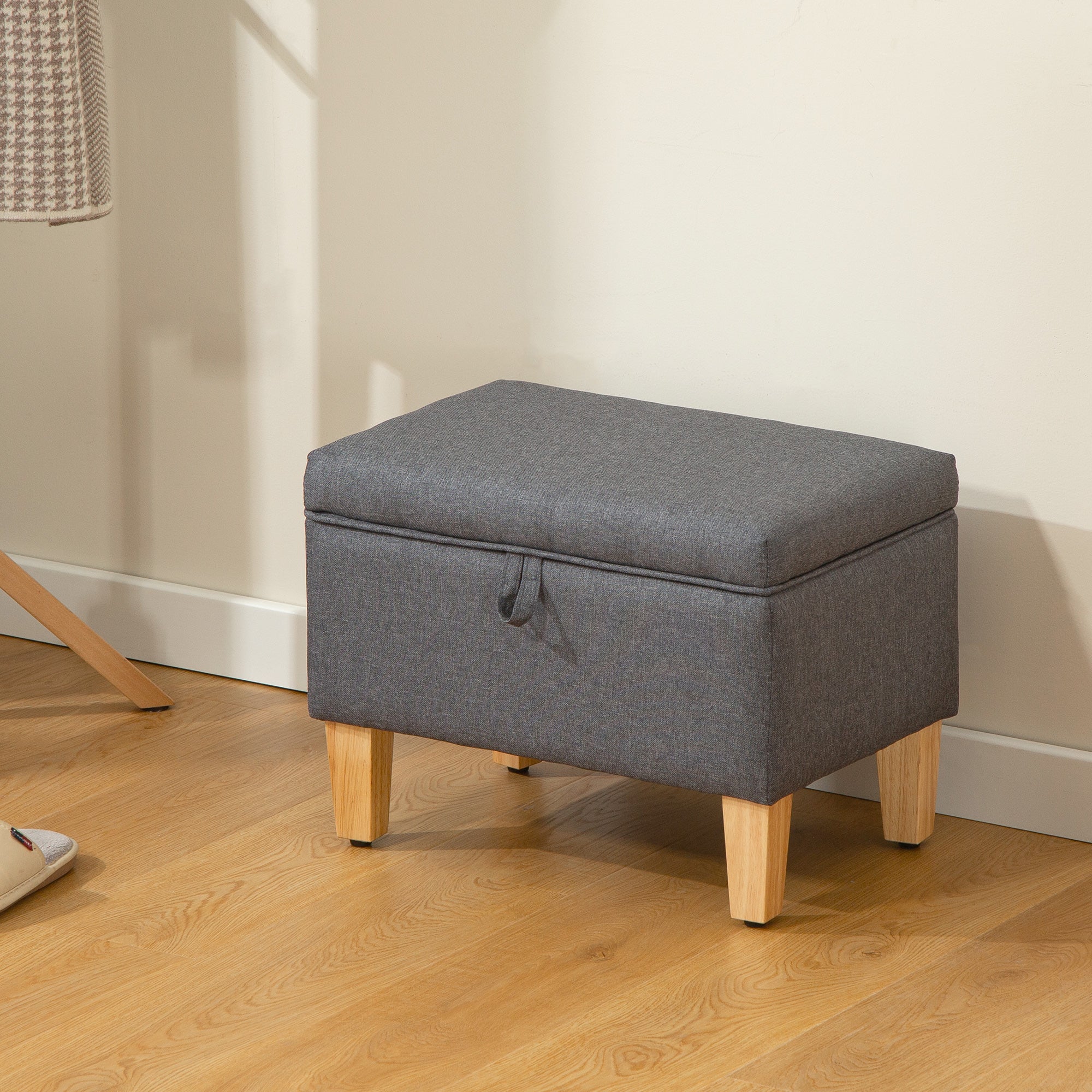 Gray textured fabric storage ottoman with light rubberwood legs in charcoal grey for bed end seating and storage