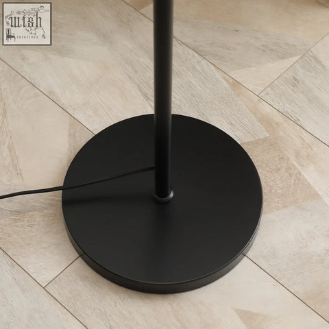 Black matte industrial floor lamp base with sleek circular steel design for living room with maximum 40w bulbs