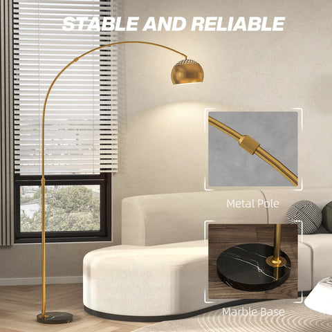 Gold tone arc floor lamp with perforated spherical shade and faux black marble base offers great stability