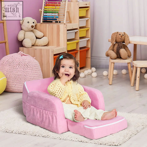 Pink plush kids armchair with wood frame and white trim doubles as a 2-in-1 sofa bed for bedroom or playroom