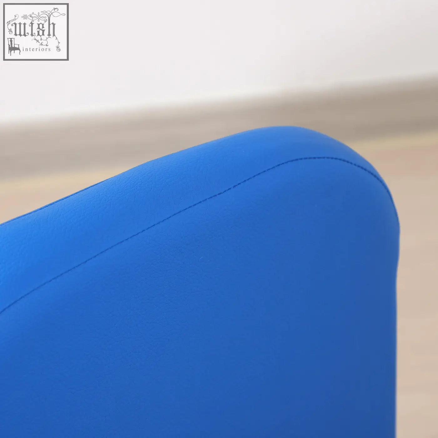 Bright blue toddler sofa chair armrest with smooth surface and neat stitching on wooden frame for playroom use