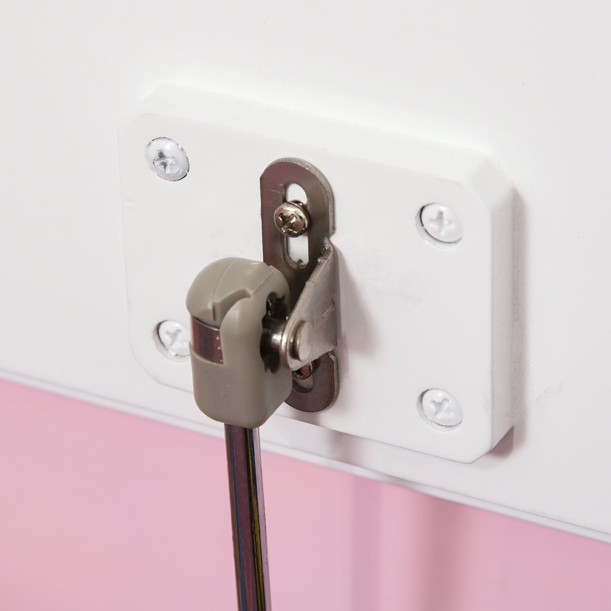 White plastic wall-mounted bracket with gray knob and metal rod on pink homcom kids storage bench toy box