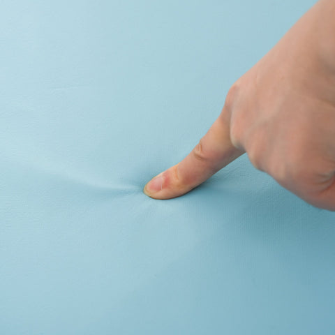 Light blue soft epe foam fabric gently pressed on homcom toddler foam climber block for gross motor development