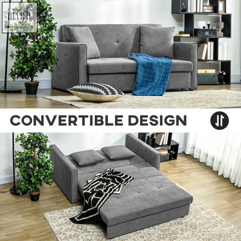 Gray fabric sofa bed with tufted cushions and blue plaid blanket in light grey seater sofa with hidden storage