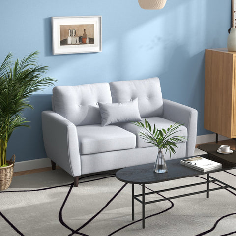 Light grey tufted 2 seater sofa with linen upholstery and dark wooden legs for living room and office use