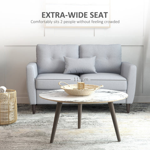 Light grey two seater sofa with linen upholstery tufted back cushions and wooden legs for living room use