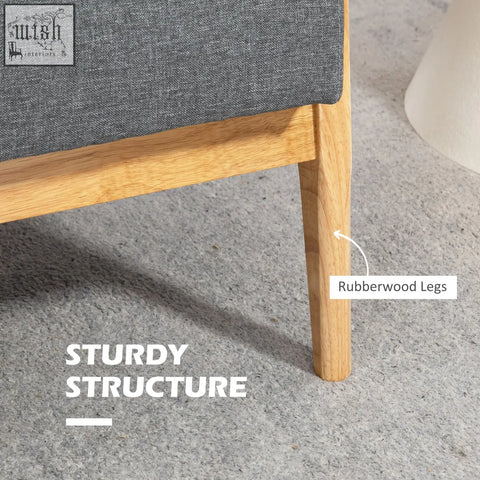 Gray upholstered chair with dark grey linen fabric upholstery and natural finish rubberwood legs