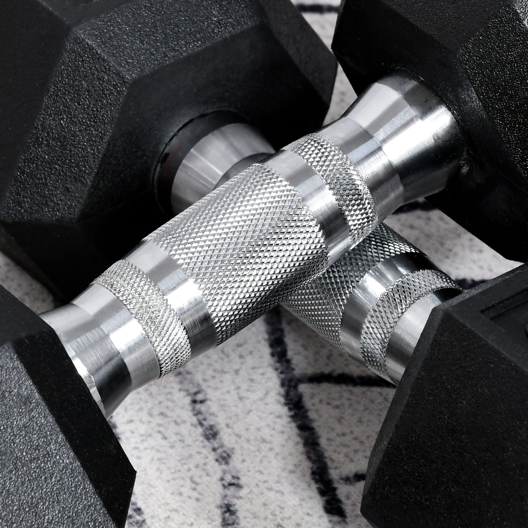 Black hex dumbbells with textured silver metal handles rubber coated perfect for home gym fitness use