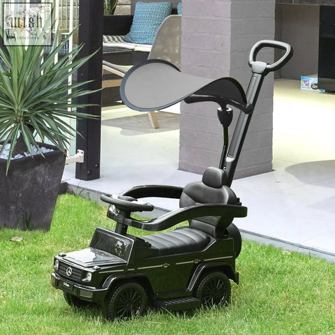 Black mercedes-benz g-wagon-themed kids ride on sliding car with sun canopy handlebar and moving steering wheel