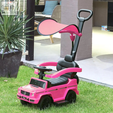 Pink and black homcom g-class kids ride on sliding car with canopy moving steering wheel and push handle