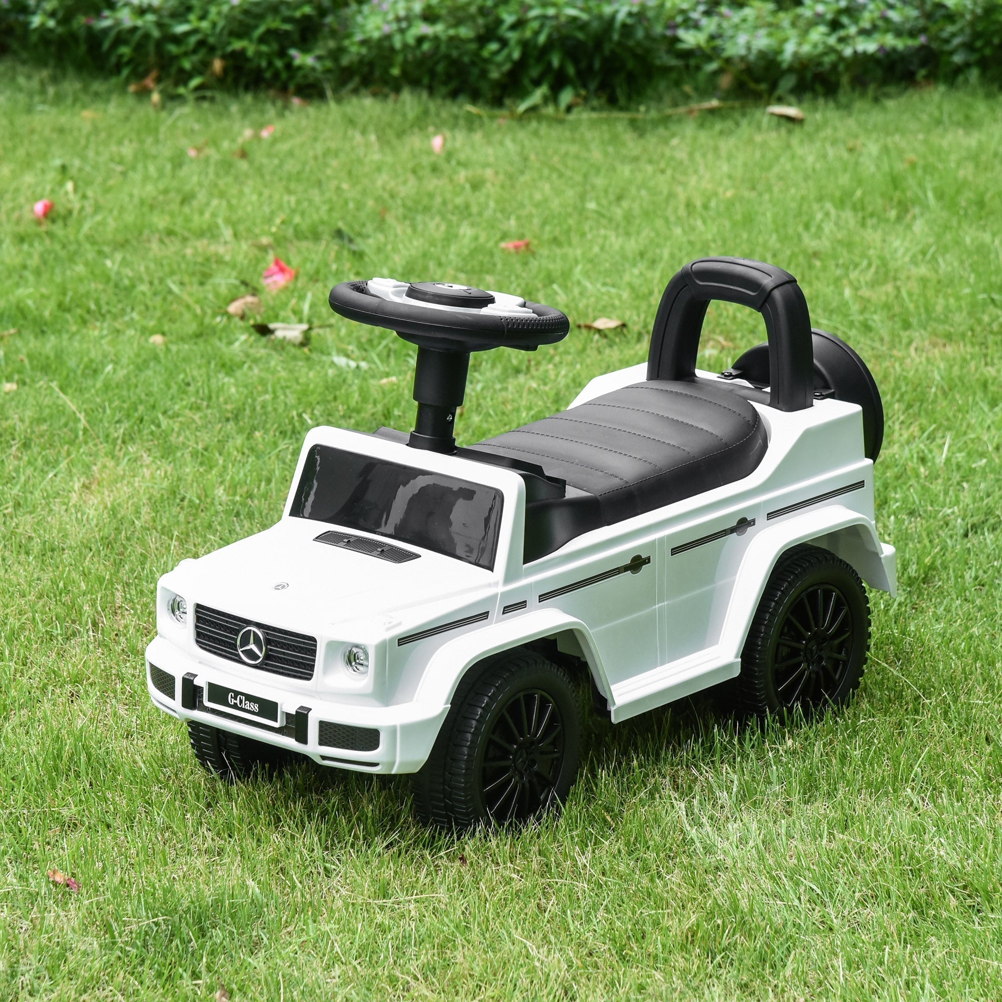 White and black mercedes-benz g-class themed homcom kids ride on car with steering wheel foot-to-floor design and under-seat storage