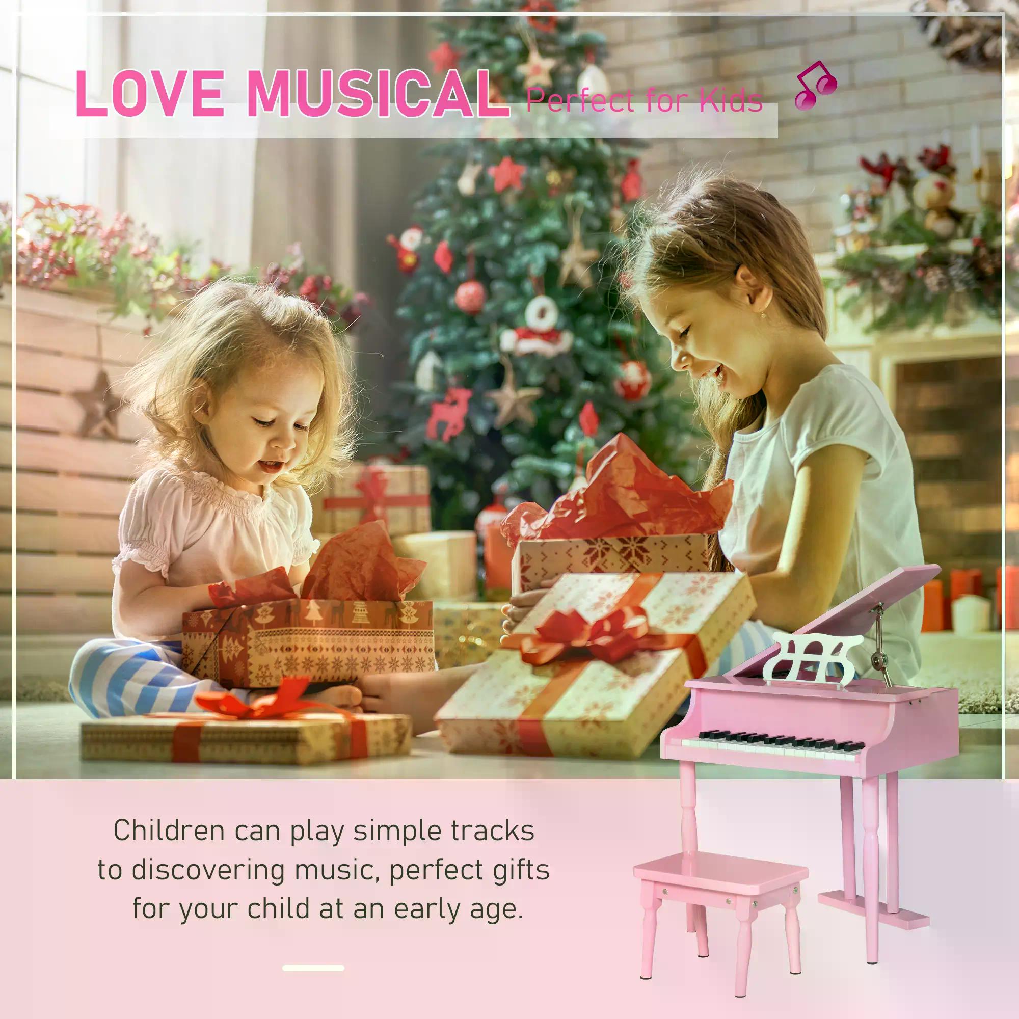 Pink wooden toy piano with 30 black and white keys and matching stool with music stand for child’s room play