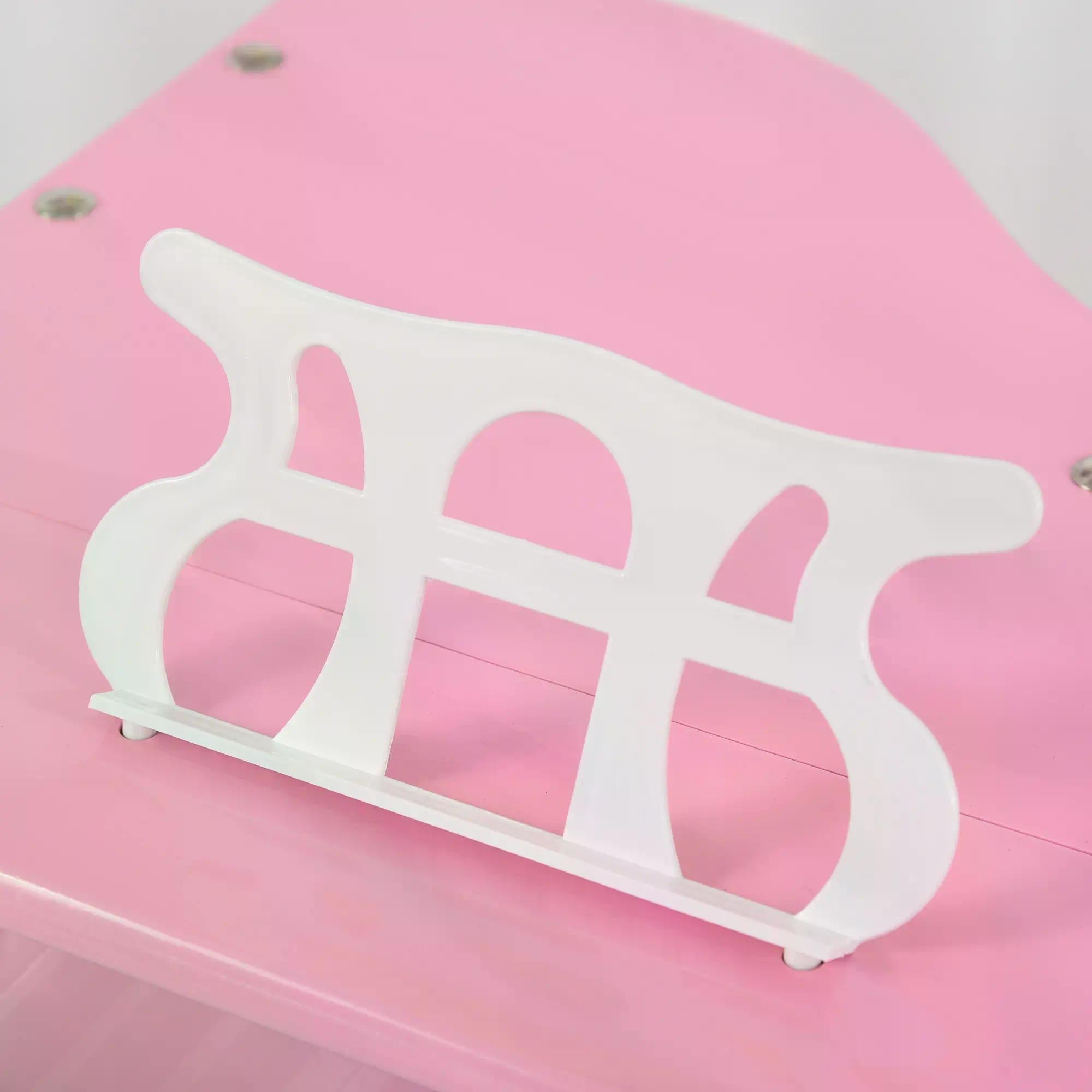 White plastic music stand with curved design on pink surface for homcom mini kids piano in childs room