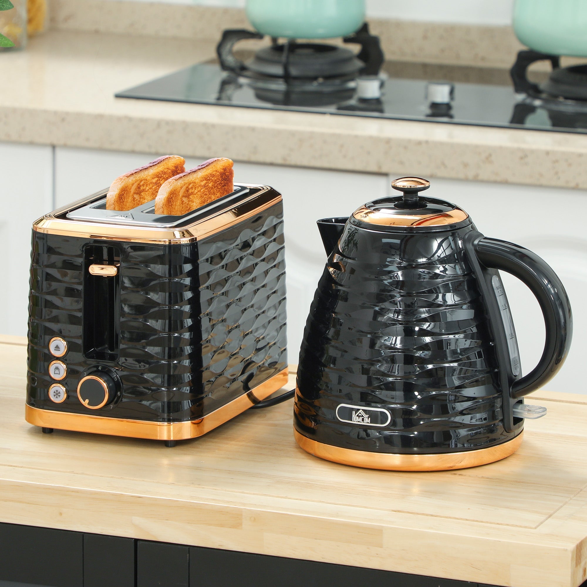 Black and rose gold textured 2 slice toaster with geometric pattern paired with rapid boil kettle in black set
