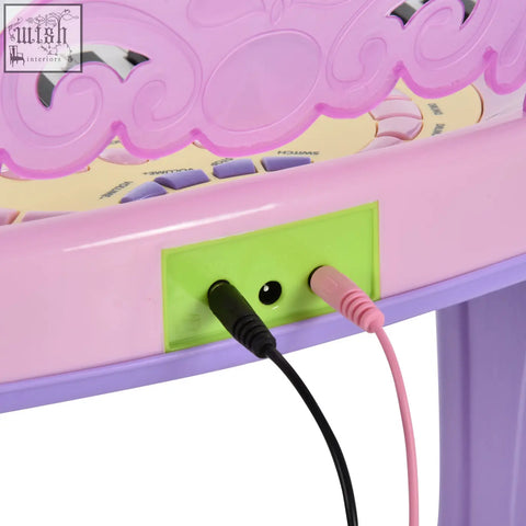Pink and purple plastic electronic keyboard with 32 keys and green audio jack panel musical instrument toy en71 7p en62115