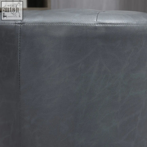 Gray faux leather ottoman with tufted top, thick sponge padding, and sturdy metal base swivel foot stool by homcom