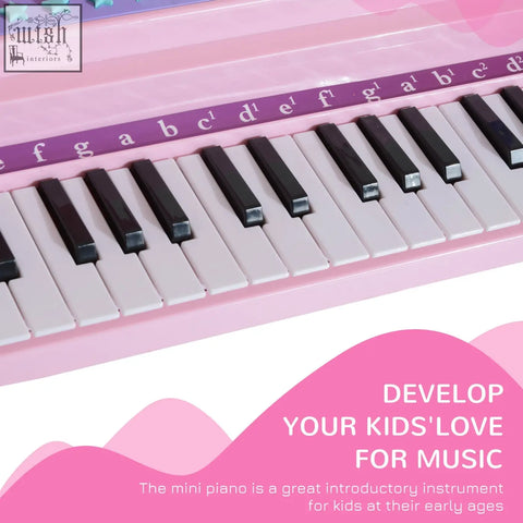 Pink abs material grand piano mini electronic keyboard with 37 keys labeled with purple notes and demo songs for kids