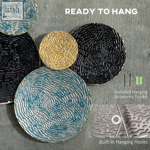 Set of modern 3d metal wall art circles in blue black gold with textured surfaces and metallic rims for home decor