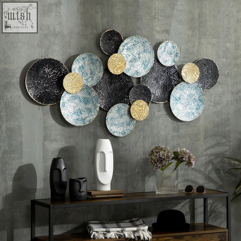 Modern metal wall art with overlapping blue black gold circular plates and woven textures for living room decor