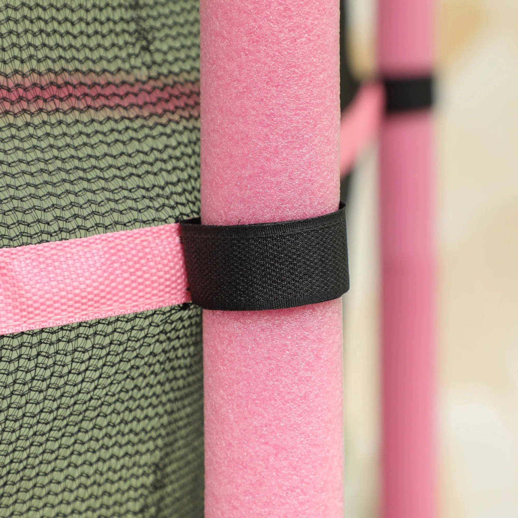 Pink foam pool noodle with black velcro strap on homcom 4.6ft kids trampoline safety enclosure for ages 3-10 years