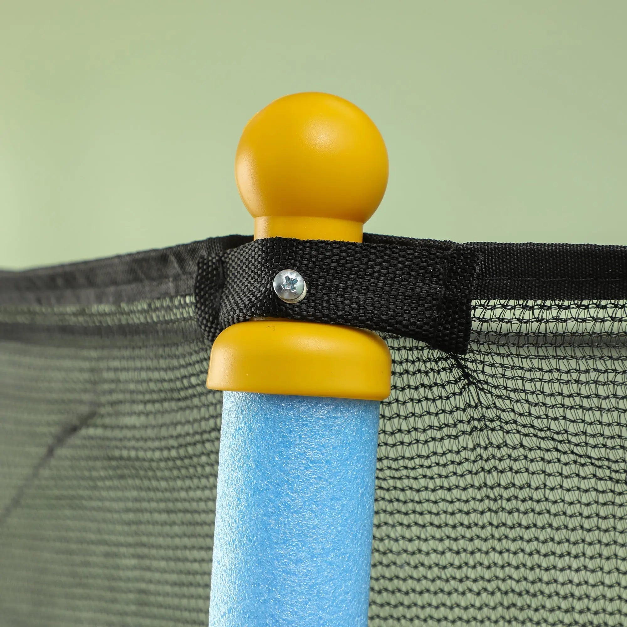 Yellow plastic corner post with blue foam core and black safety net strap on homcom kids trampoline for indoor outdoor use