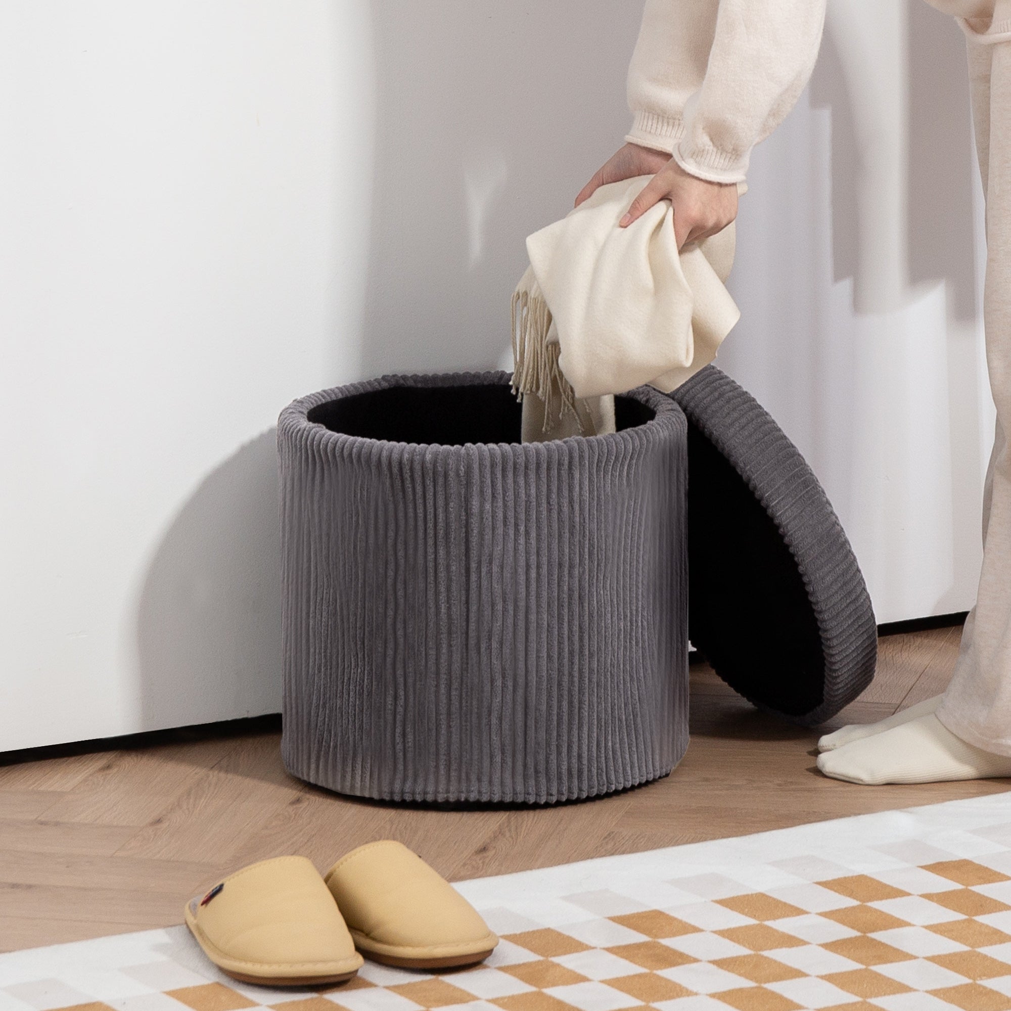 Gray corduroy storage ottoman with black interior and removable lid perfect as an elegant vanity stool or footstool