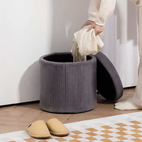 Gray corduroy storage ottoman with black interior and removable lid perfect as an elegant vanity stool or footstool