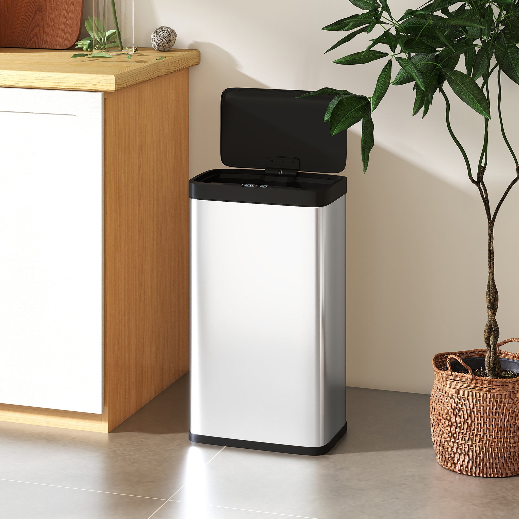 Silver stainless steel sensor bin with black lid and base features hand-wave sensor and closes softly for kitchen use